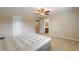 Spacious bedroom with a ceiling fan and access to the bathroom at 1904 Eloise Cove Dr, Winter Haven, FL 33884