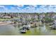 Aerial shot of a dock on the lake surrounded by mature trees and Spanish Moss at 1904 Eloise Cove Dr, Winter Haven, FL 33884