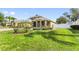 Beautifully landscaped home with a well-manicured lawn at 1904 Eloise Cove Dr, Winter Haven, FL 33884