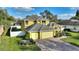 Two-story home with an attached two-car garage, landscaping, and a brick driveway at 1904 Eloise Cove Dr, Winter Haven, FL 33884