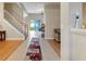 Open foyer with tile flooring, staircase, and view of the screened-in patio at 1904 Eloise Cove Dr, Winter Haven, FL 33884