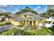 Two-story home featuring a landscaped front yard, brick walkway, and three car garage at 1904 Eloise Cove Dr, Winter Haven, FL 33884