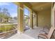 Spacious screened-in front porch with ample natural light, tile flooring, and seating area at 1904 Eloise Cove Dr, Winter Haven, FL 33884