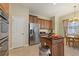 Well-lit kitchen with stainless steel refrigerator, breakfast nook, and island at 1904 Eloise Cove Dr, Winter Haven, FL 33884