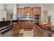 Modern kitchen with stainless steel appliances, granite countertops, and ample cabinet space at 1904 Eloise Cove Dr, Winter Haven, FL 33884