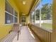 Screened lanai with tiled floor, ceiling fan, furniture, and views of backyard at 1904 Eloise Cove Dr, Winter Haven, FL 33884