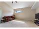 Bright living room with carpet, high ceilings, and a cozy sofa at 1904 Eloise Cove Dr, Winter Haven, FL 33884