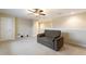 Neutral living room with a comfortable couch and a ceiling fan at 1904 Eloise Cove Dr, Winter Haven, FL 33884