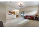 Spacious living room with carpet, ceiling fan, and sliding glass doors at 1904 Eloise Cove Dr, Winter Haven, FL 33884