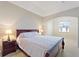 Tranquil main bedroom featuring a comfortable bed and soft lighting at 1904 Eloise Cove Dr, Winter Haven, FL 33884