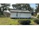 Damaged exterior of unfinished home with partial siding and roof repairs at 1928 Old Apopka Rd, Apopka, FL 32703