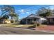 Charming home with a covered front porch, surrounded by a lush lawn at 201 Dr J A Wiltshire W Ave, Lake Wales, FL 33853