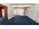 Spacious room featuring blue carpeting, white walls, and doorways throughout at 201 Dr J A Wiltshire W Ave, Lake Wales, FL 33853