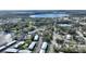 Bird's-eye view showing the home's location near a lake and community amenities at 208 Country Ne Ln # 208, Winter Haven, FL 33881