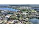 Overhead view of a neighborhood with a pond and home featuring nearby lakes and surrounding scenery at 208 Country Ne Ln # 208, Winter Haven, FL 33881