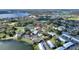 Expansive aerial view of neighborhood with lakes, landscaping, pools, and community amenities at 208 Country Ne Ln # 208, Winter Haven, FL 33881