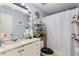 Bathroom featuring vanity with a white countertop and shower and tub combo at 208 Country Ne Ln # 208, Winter Haven, FL 33881