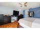 Bedroom with modern entertainment area and large closet space at 208 Country Ne Ln # 208, Winter Haven, FL 33881