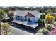 Inviting condominium complex featuring a covered parking area and lush landscaping at 208 Country Ne Ln # 208, Winter Haven, FL 33881