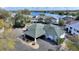 Attractive home exterior featuring lush landscaping, a covered parking area, and scenic surroundings at 208 Country Ne Ln # 208, Winter Haven, FL 33881