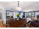 Spacious living room featuring a dining table and an open floor plan at 208 Country Ne Ln # 208, Winter Haven, FL 33881