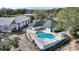 Beautifully maintained pool area with lush landscaping and a spacious deck for entertaining at 208 Country Ne Ln # 208, Winter Haven, FL 33881