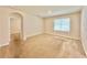 A spacious bedroom featuring neutral paint, plush carpet, and a window with natural light at 2288 Rose Blvd, Winter Haven, FL 33881