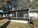 Home exterior features a screened-in patio area that offers a relaxing outdoor space at 229 Durrell Rd, Winter Haven, FL 33884
