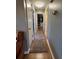 Hallway with laminate floors and closet storage at 229 Durrell Rd, Winter Haven, FL 33884