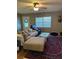 Inviting living room with hardwood floors, plush seating, and a decorative rug at 229 Durrell Rd, Winter Haven, FL 33884