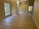 Open living space features tile floors, a dining area chandelier, and natural lighting at 2673 Rutledge Ct, Winter Haven, FL 33884