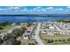 Aerial view of the house in a neighborhood with a lake in the background at 2706 Rochelle Dr, Winter Haven, FL 33881