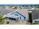 Aerial view of home showing backyard, screened-in patio, exterior of home and neighborhood at 2706 Rochelle Dr, Winter Haven, FL 33881