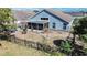 Aerial view of the backyard featuring a black metal fence, lawn and exterior of home with screened in patio at 2706 Rochelle Dr, Winter Haven, FL 33881