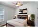Inviting bedroom featuring a cozy bed, mounted TV, and modern accents, providing a comfortable and stylish retreat at 2706 Rochelle Dr, Winter Haven, FL 33881