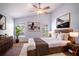 Comfortable bedroom with a bed, dresser, and windows providing natural light, creating a serene and inviting space at 2706 Rochelle Dr, Winter Haven, FL 33881