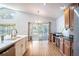 Kitchen overlooking backyard features wood floors and stainless appliances at 2706 Rochelle Dr, Winter Haven, FL 33881