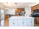 Spacious kitchen with a large center island and stainless steel appliances at 2706 Rochelle Dr, Winter Haven, FL 33881
