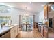Kitchen dining area features wood floors, stainless appliances, and backyard view at 2706 Rochelle Dr, Winter Haven, FL 33881