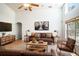 Inviting living room showcasing modern decor, comfortable seating, and abundant natural light from large windows at 2706 Rochelle Dr, Winter Haven, FL 33881