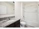 Bathroom featuring vanity with granite countertop and shower-tub combination at 2759 Grandbury Grove Rd, Lakeland, FL 33811