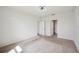 Bedroom featuring neutral carpet, white walls, and doorways to other rooms at 2759 Grandbury Grove Rd, Lakeland, FL 33811