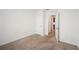 Bedroom with neutral carpet, white walls, and access to other rooms at 2759 Grandbury Grove Rd, Lakeland, FL 33811