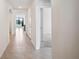 Hallway with tile floors, arched doorways, and an open floor plan at 2759 Grandbury Grove Rd, Lakeland, FL 33811