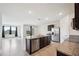 Open kitchen with stainless appliances, granite countertops, and an island at 2759 Grandbury Grove Rd, Lakeland, FL 33811
