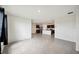 Open-concept layout with neutral tile floors and views of the kitchen at 2759 Grandbury Grove Rd, Lakeland, FL 33811