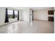 Open-concept floorplan offers neutral tile floors and lots of natural light at 2759 Grandbury Grove Rd, Lakeland, FL 33811
