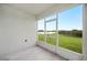 Enclosed patio offers scenic views of the yard and a nearby lake at 2759 Grandbury Grove Rd, Lakeland, FL 33811