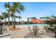 Community pool area with ample seating, palm trees, and water features at 2759 Grandbury Grove Rd, Lakeland, FL 33811