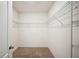 Walk-in closet with wire shelving and neutral carpet at 2759 Grandbury Grove Rd, Lakeland, FL 33811